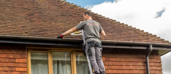 Gutter cleaning a residential property in Watlington